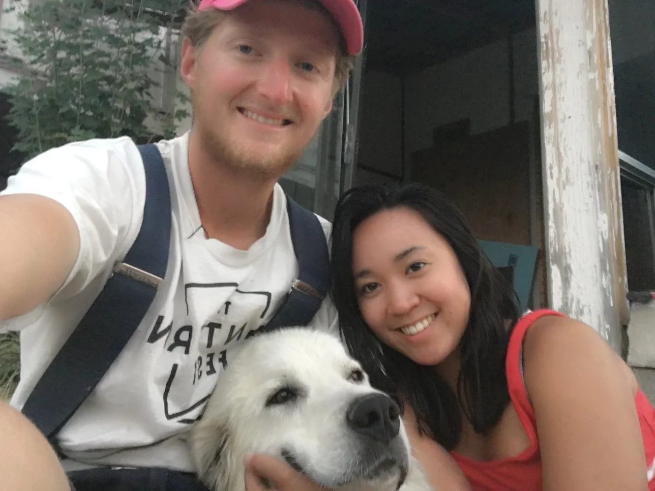 The two of us crouched in the yard with Chewy, our Great Pyrenees, between us